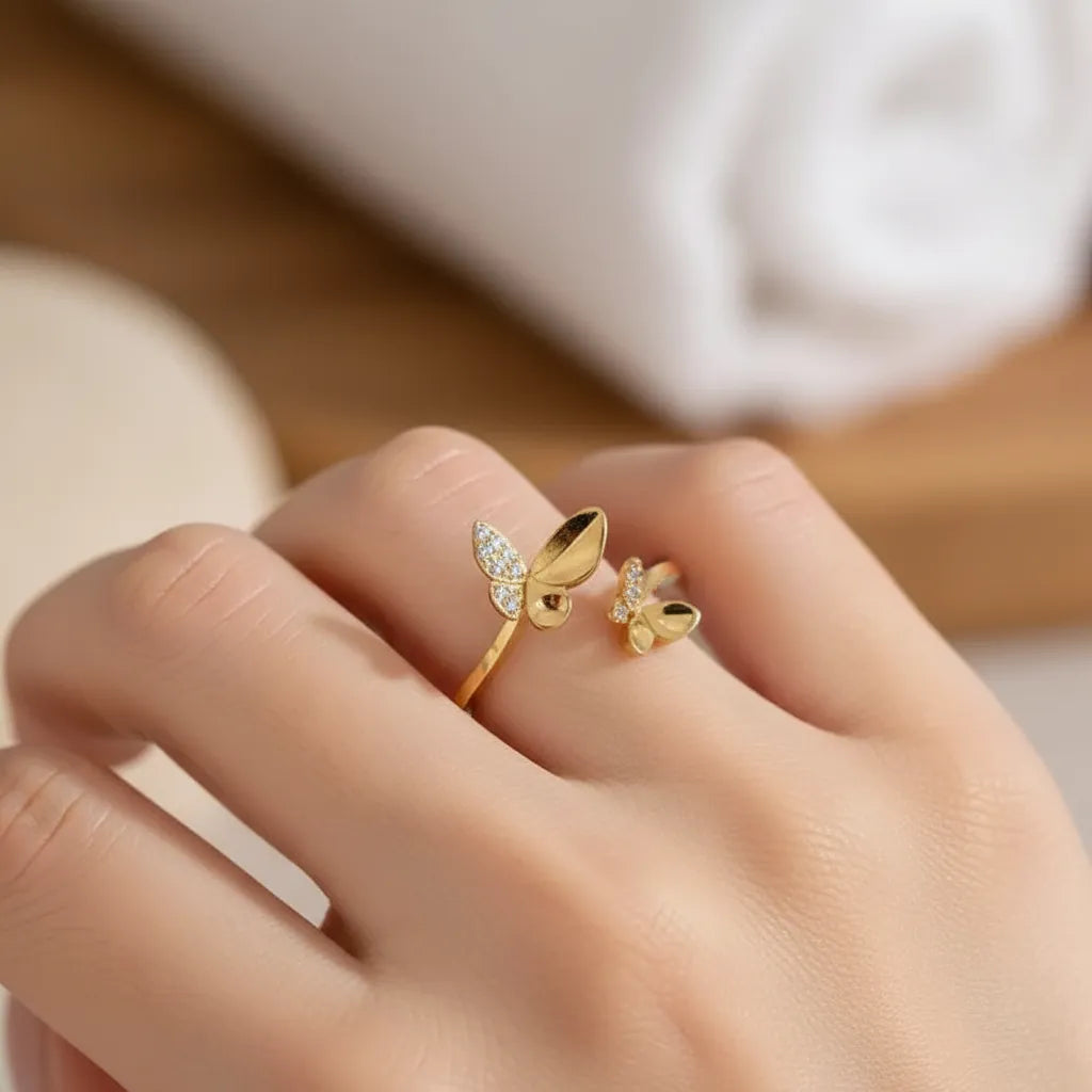 Woman wearing gold butterfly open ring, spirit animal jewelry for transformation