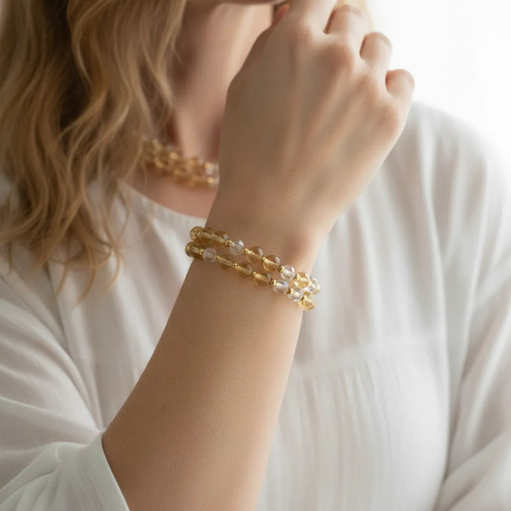 Woman wearing a citrine beaded stretch bracelet, solar plexus chakra jewelry