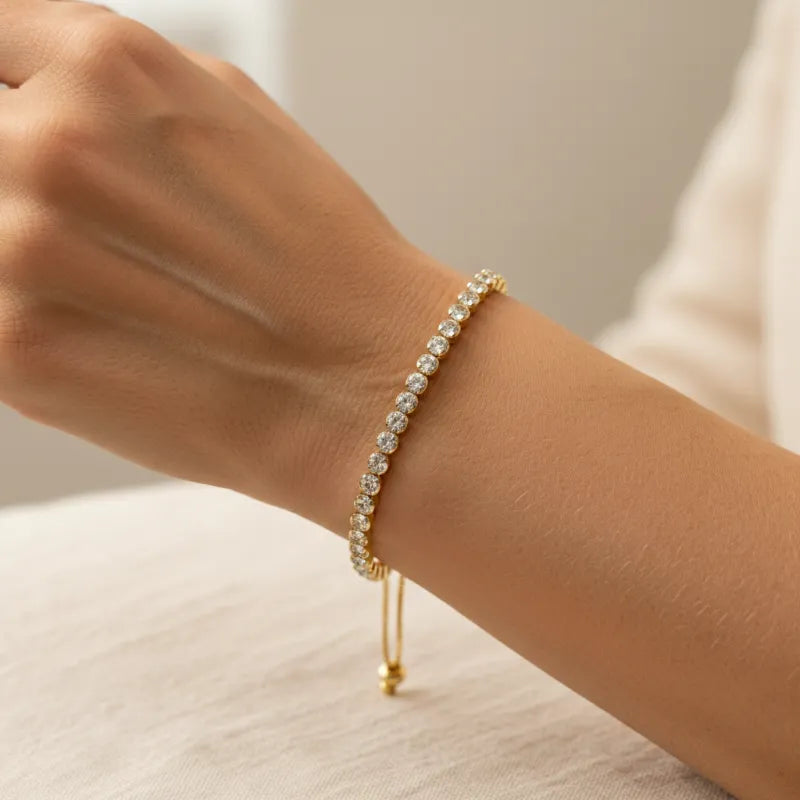 Woman wearing a gold clear crystal beaded bracelet