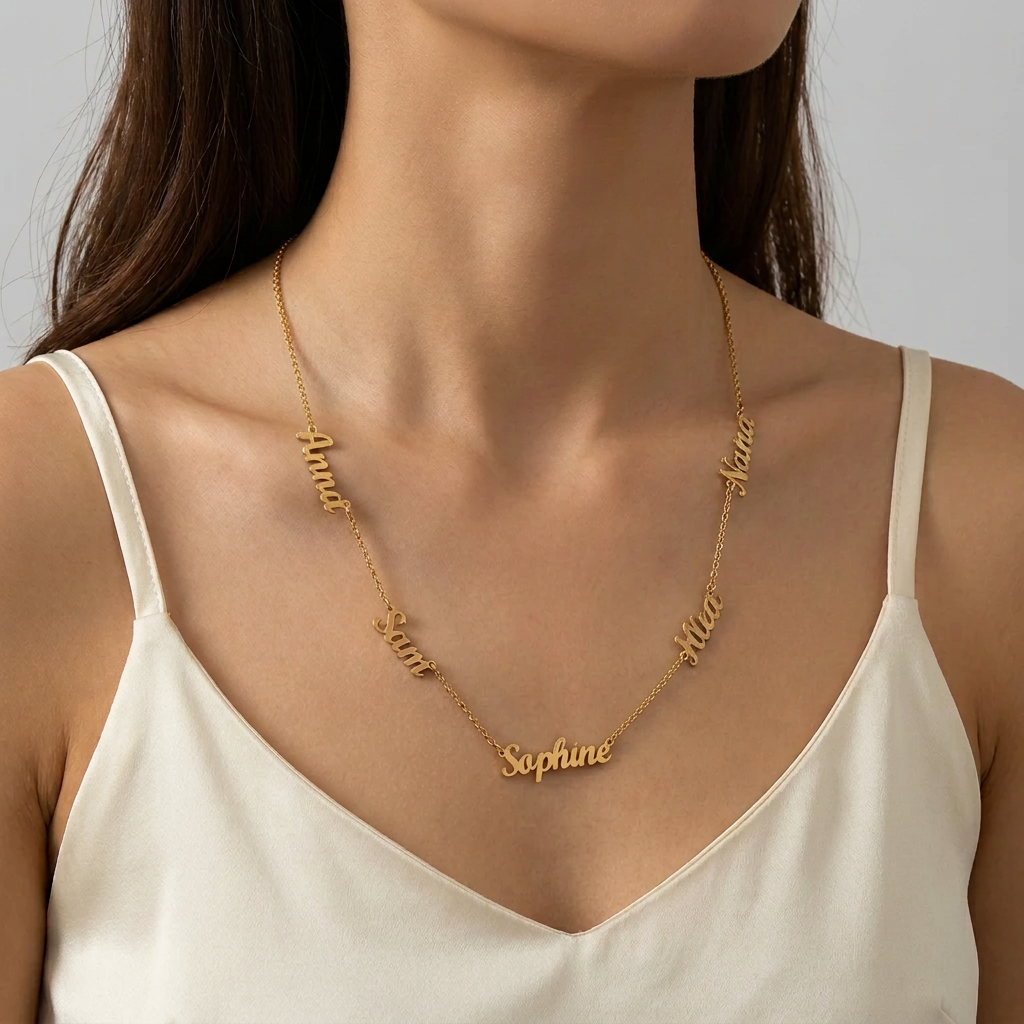 Woman wearing a custom name necklace with five script names