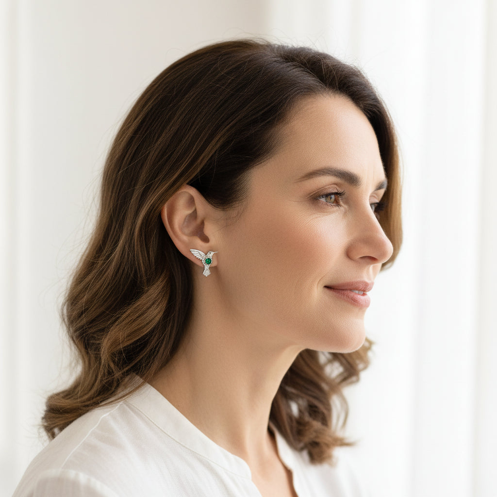 Woman wearing green crystal stud earrings in sterling silver — spirit animal jewelry for lightness