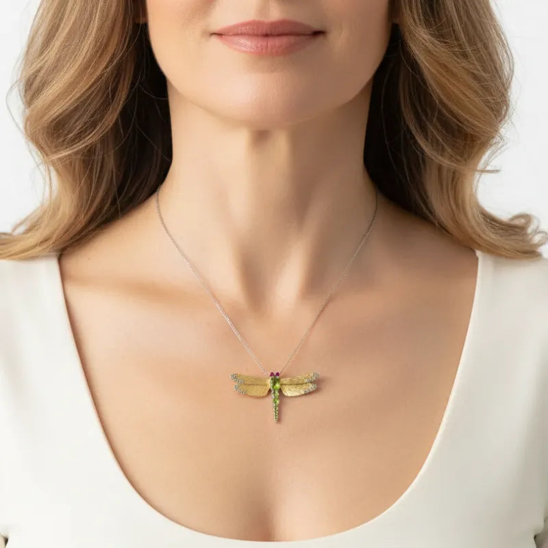Woman wearing a dragonfly pendant that doubles as a brooch, spirit animal jewelry