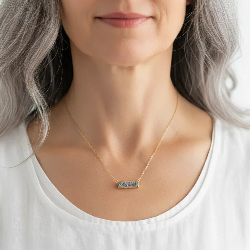 Woman wearing a double sided grey druzy pendant necklace