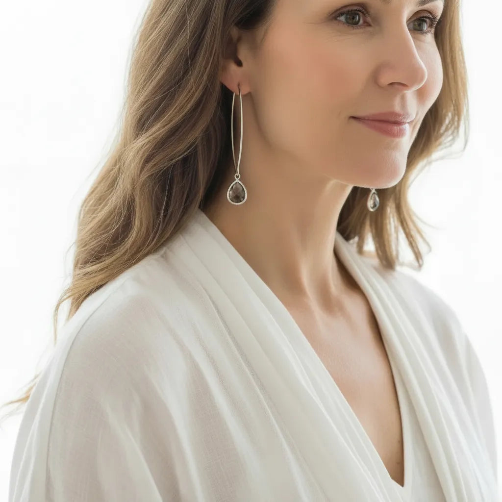 Woman wearing Dusk Elegant twilight glass drop earrings in silver