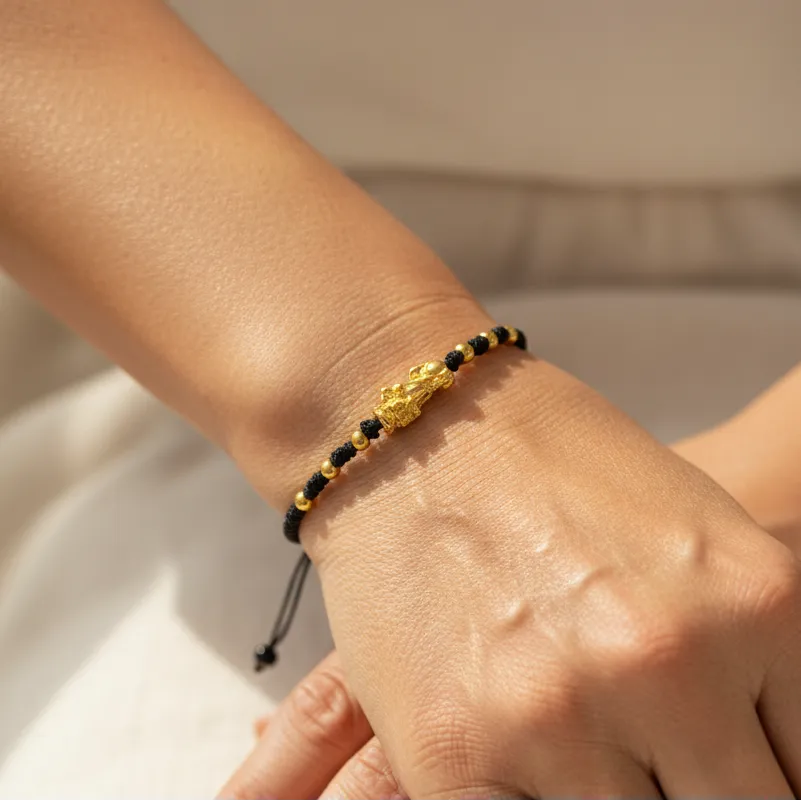 Woman wearing a feng shui dragon charm bracelet, protection symbol jewelry