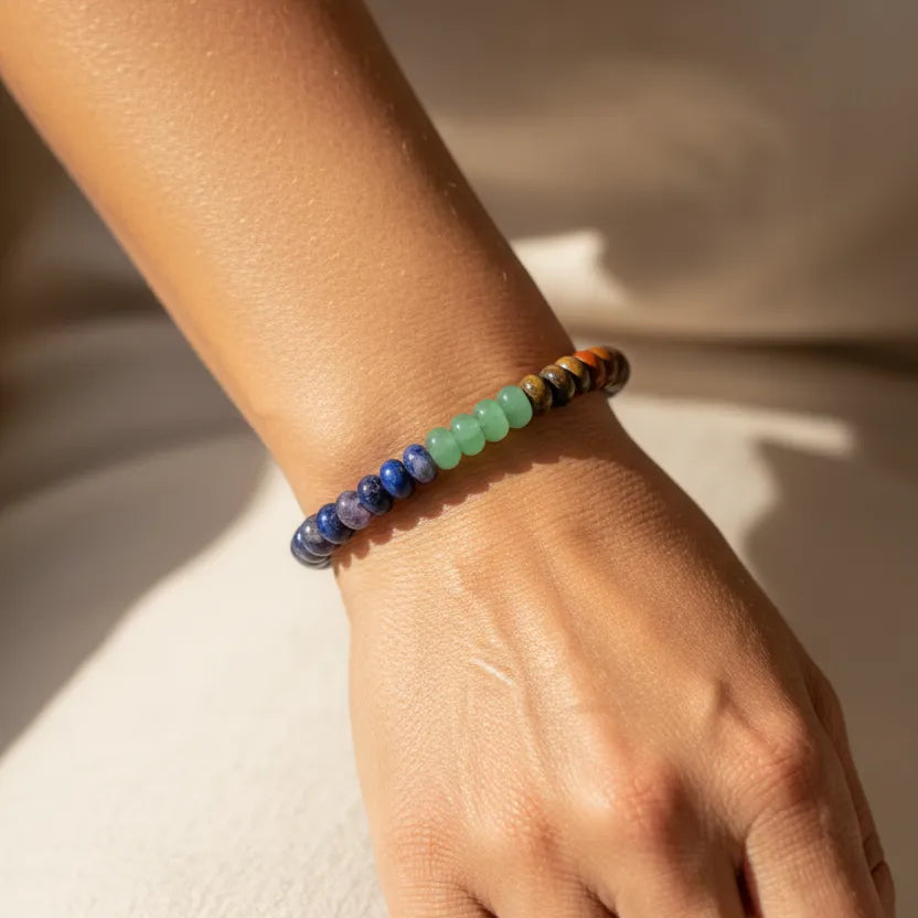 Woman wearing a gemstone stretch bracelet with mixed stones