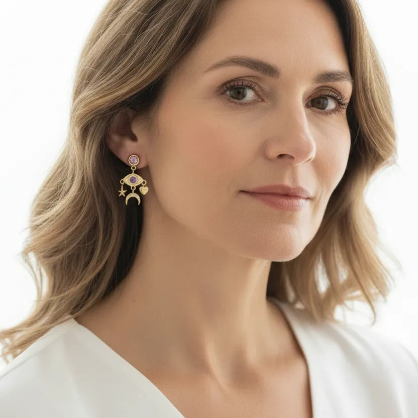 Woman wearing gold third eye dangle earrings, third eye chakra jewelry