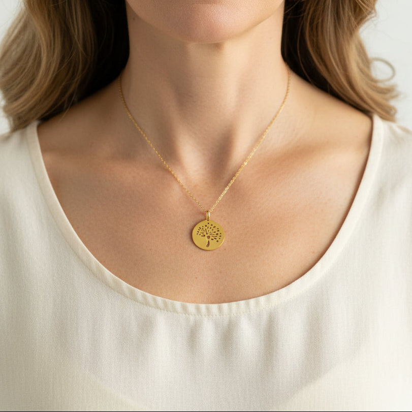 Woman wearing a gold tree of life medallion necklace — spiritual symbol jewelry for growth