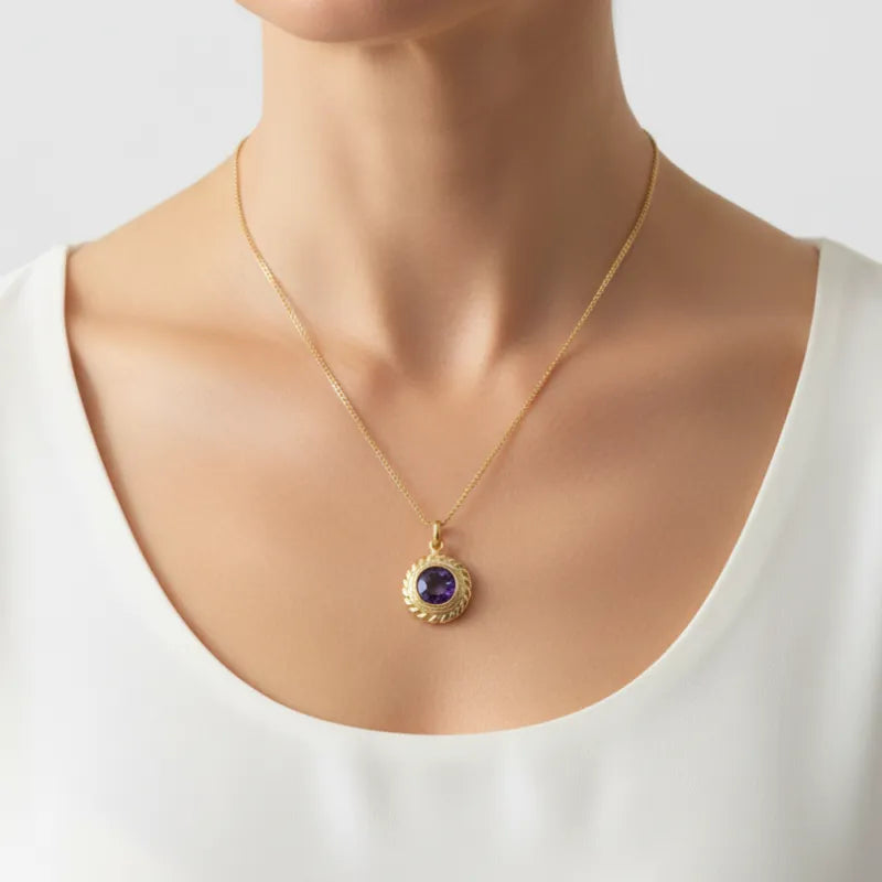 Woman wearing the gold Amethyst Halo pendant necklace, February birthstone jewelry