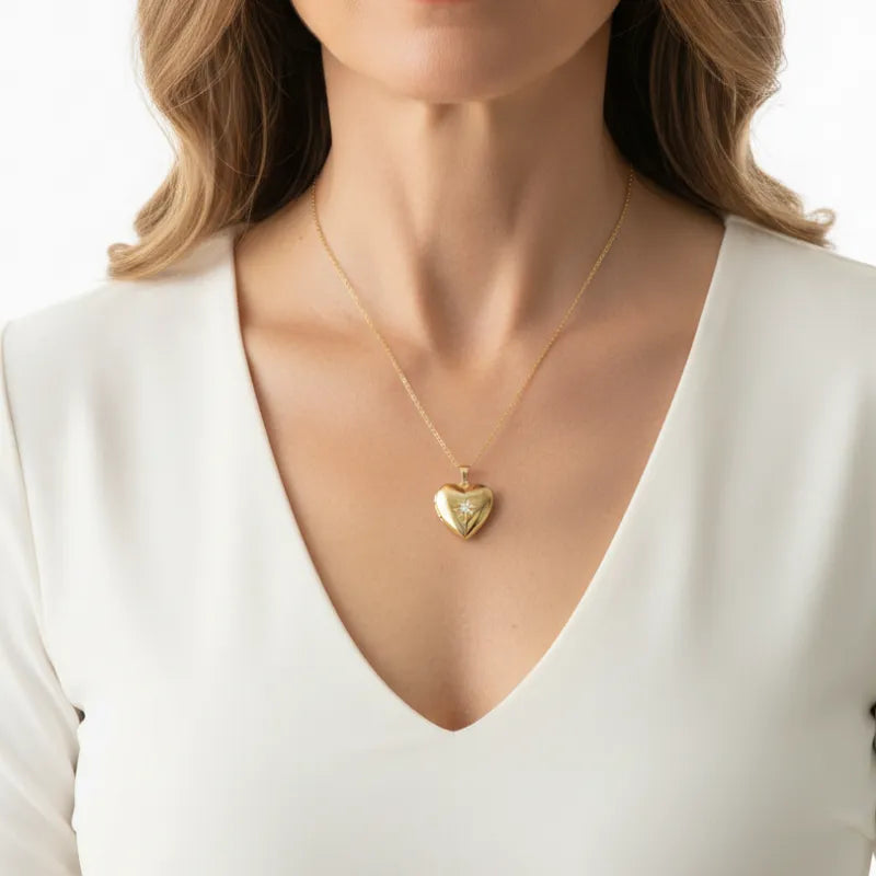Close-up of a woman wearing a heart photo locket necklace