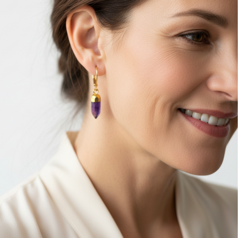 Woman wearing amethyst hexagon leverback earrings, February birthstone jewelry