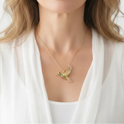 Woman wearing a hummingbird pendant necklace, spirit animal jewelry