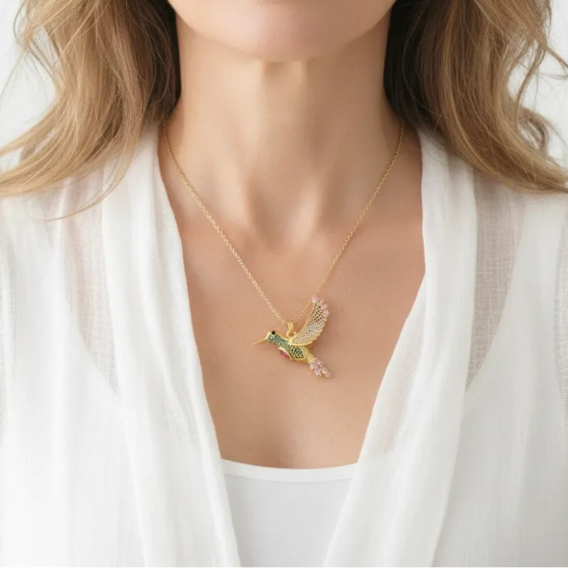 Woman wearing a hummingbird pendant necklace, spirit animal jewelry