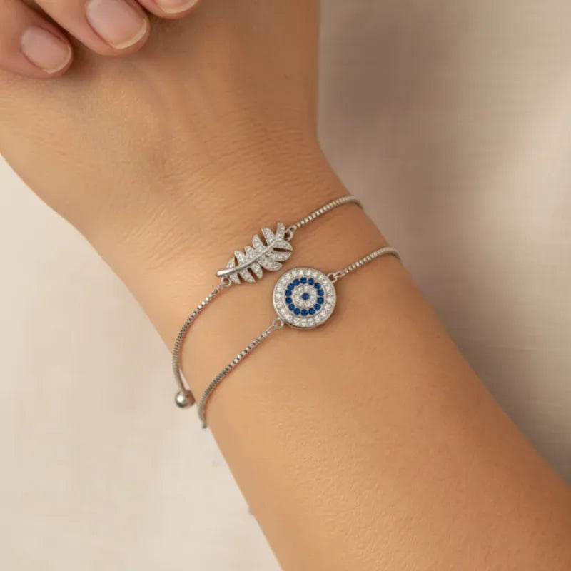 Evil eye adjustable bracelet with moon and star celestial charms, protection symbol jewelry