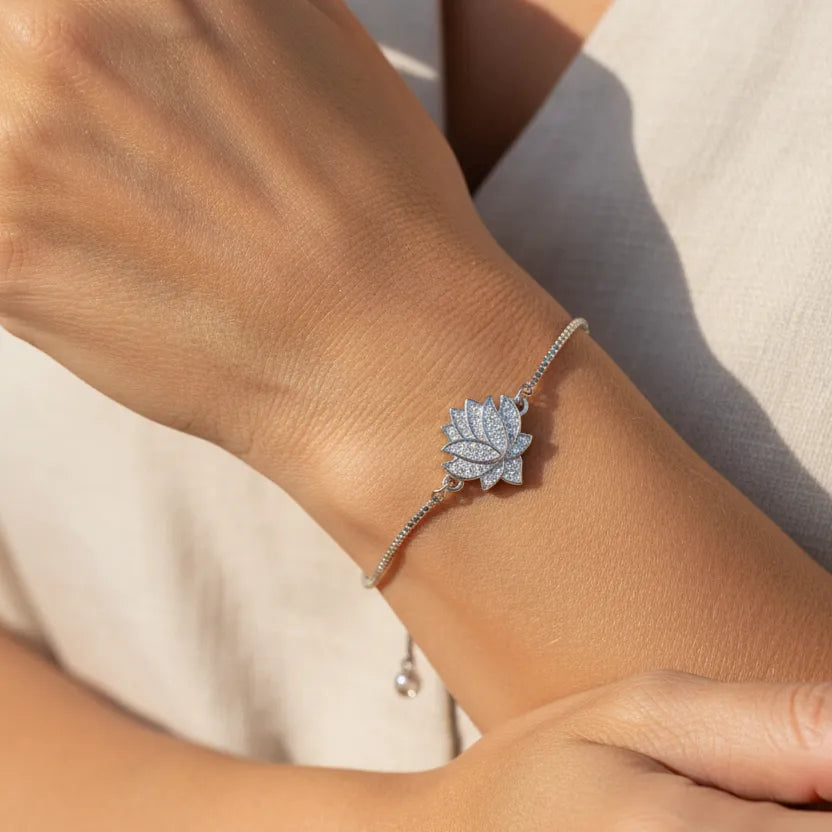 Woman wearing a lotus flower charm bracelet