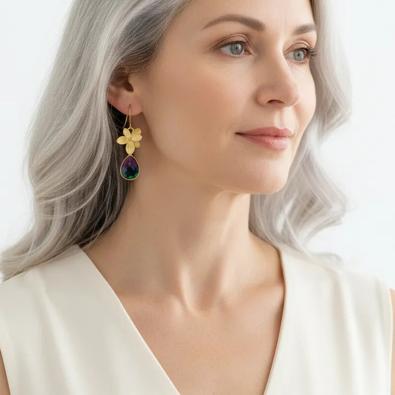 Woman wearing short peacock orchid drop earrings