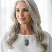 Woman wearing a silver owl pendant necklace — spirit animal jewelry for wisdom
