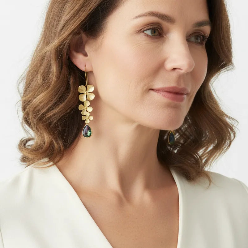 Woman wearing long peacock orchid drop earrings