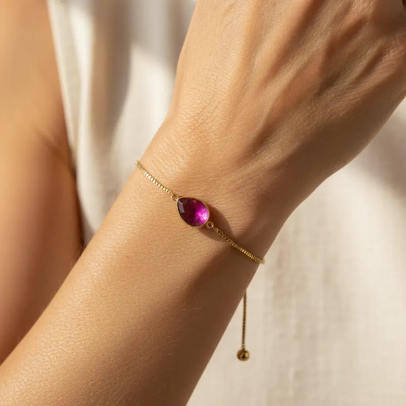 Woman wearing a pink ombre beaded stretch bracelet