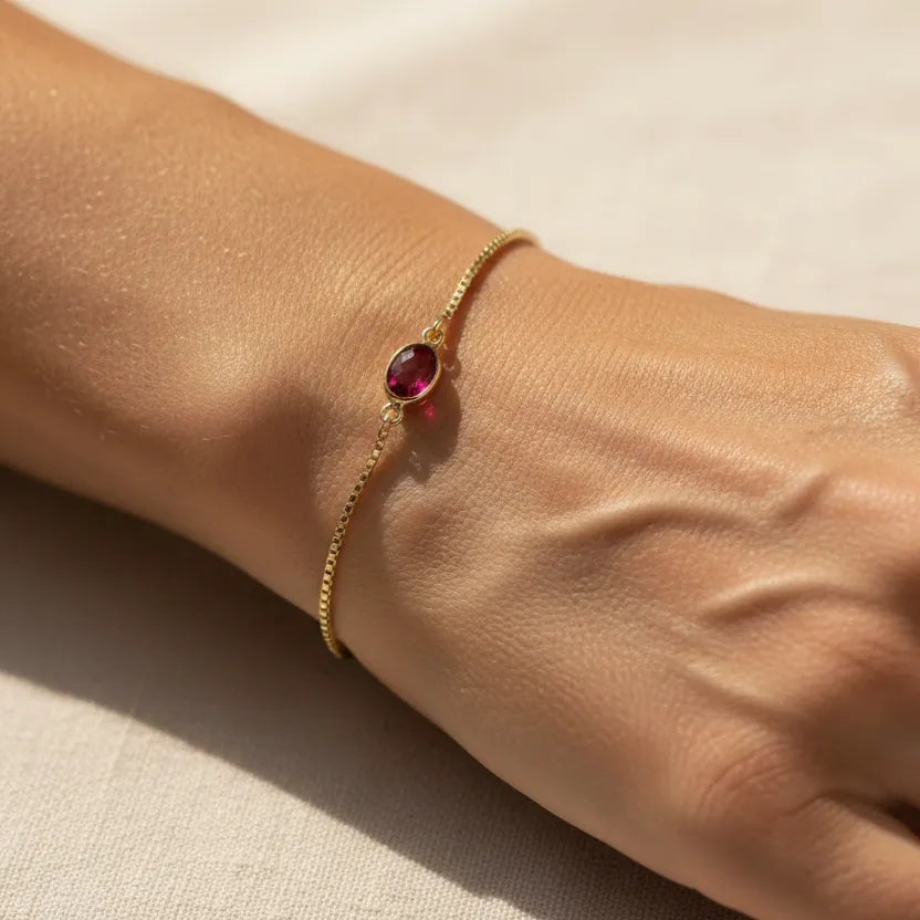Woman wearing a pink tourmaline bracelet, October birthstone jewelry