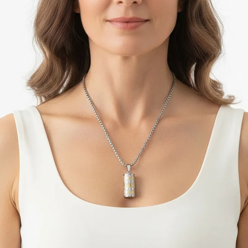 Woman wearing a silver prayer wheel pendant, spiritual symbol jewelry