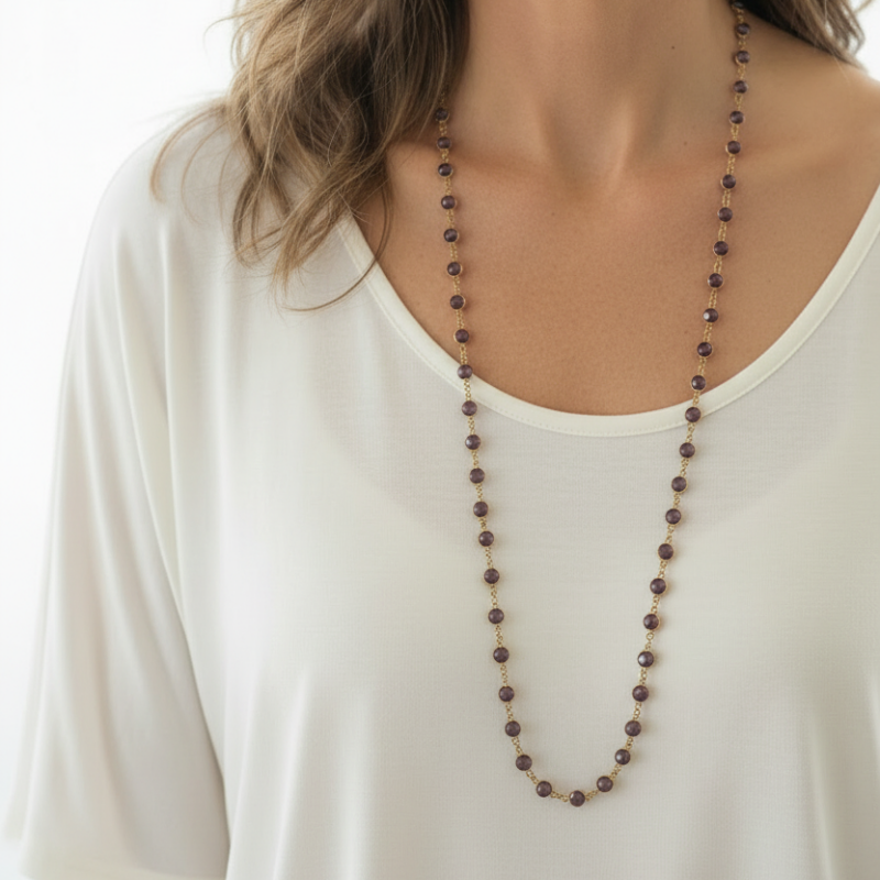 Woman wearing amethyst purple faceted crystal bead necklace, 30 inch long layering strand
