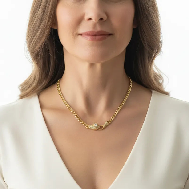 Woman wearing a snake pendant necklace with crystal eyes, spirit animal jewelry