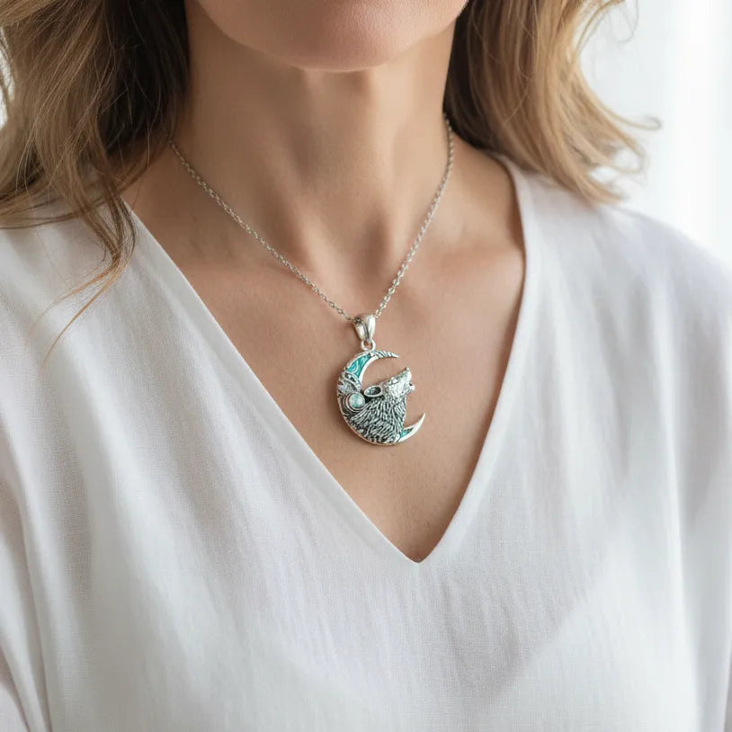 Woman wearing a sterling silver wolf chain necklace, spirit animal jewelry