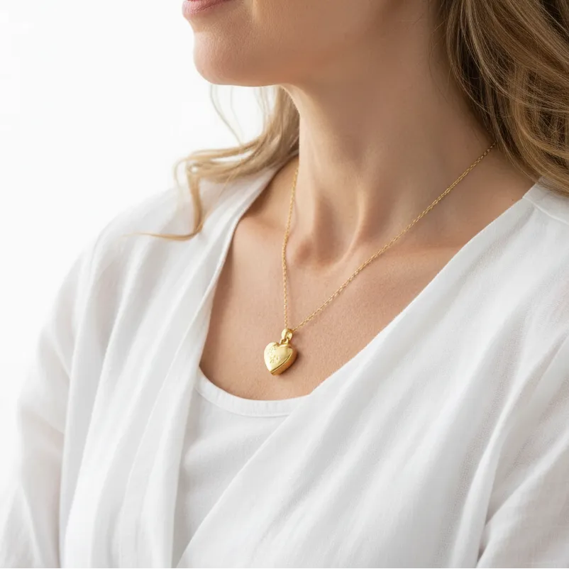 Woman wearing The After pet memorial jewelry set, shown with its gift bag