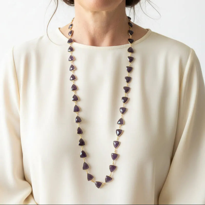 Woman wearing a natural amethyst shield-cut gemstone chain necklace