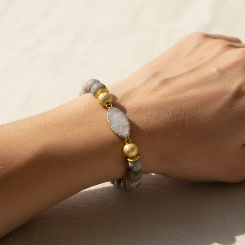 Woman wearing a white gemstone stretch bracelet