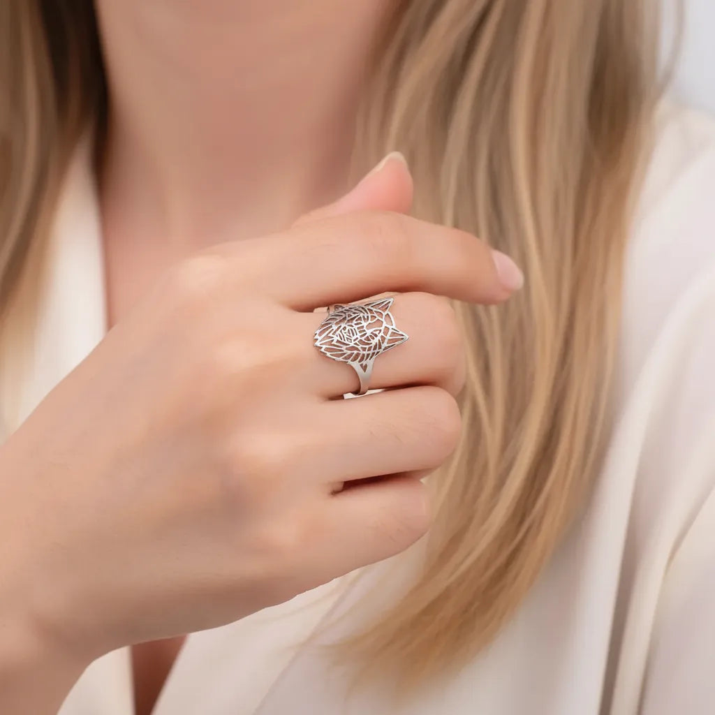 Woman wearing a sterling silver wolf ring, spirit animal jewelry