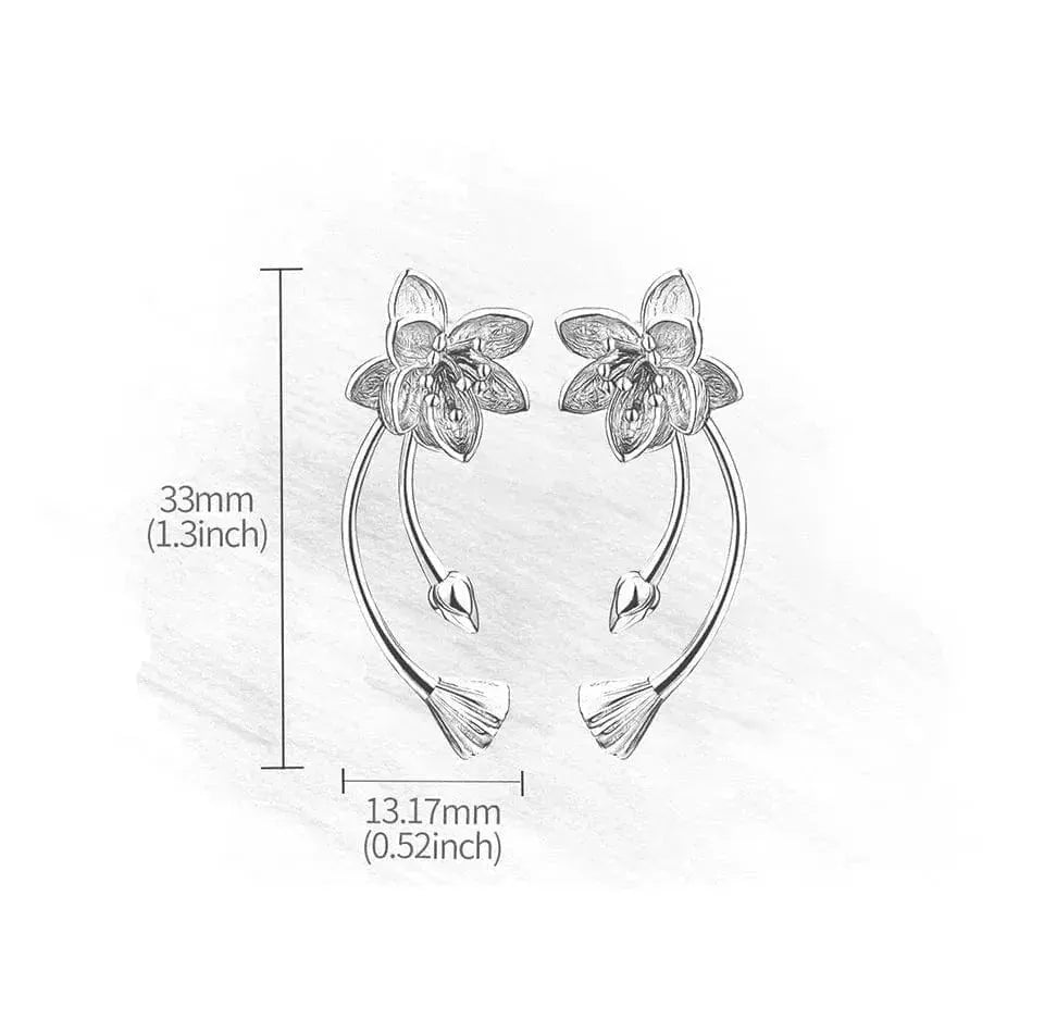 Floral earrings with dimensions on a light gray background