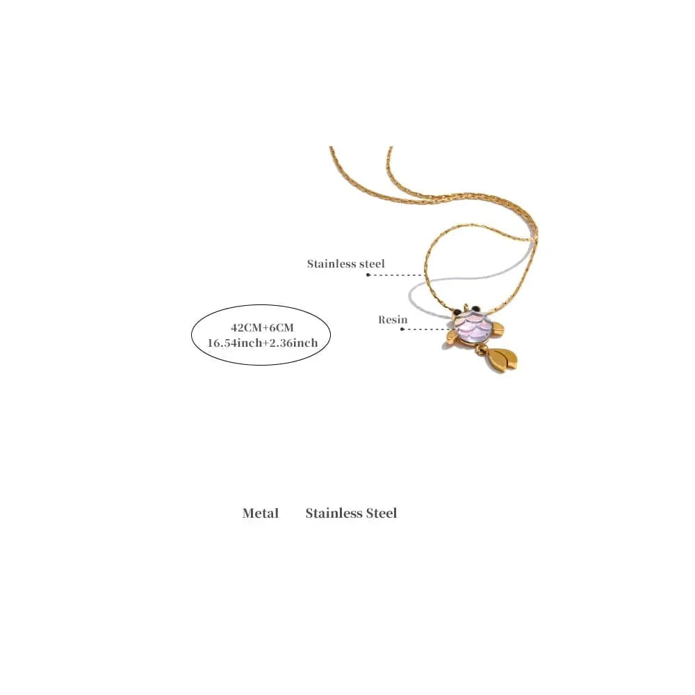 Gold necklace with a pink pendant on a white background