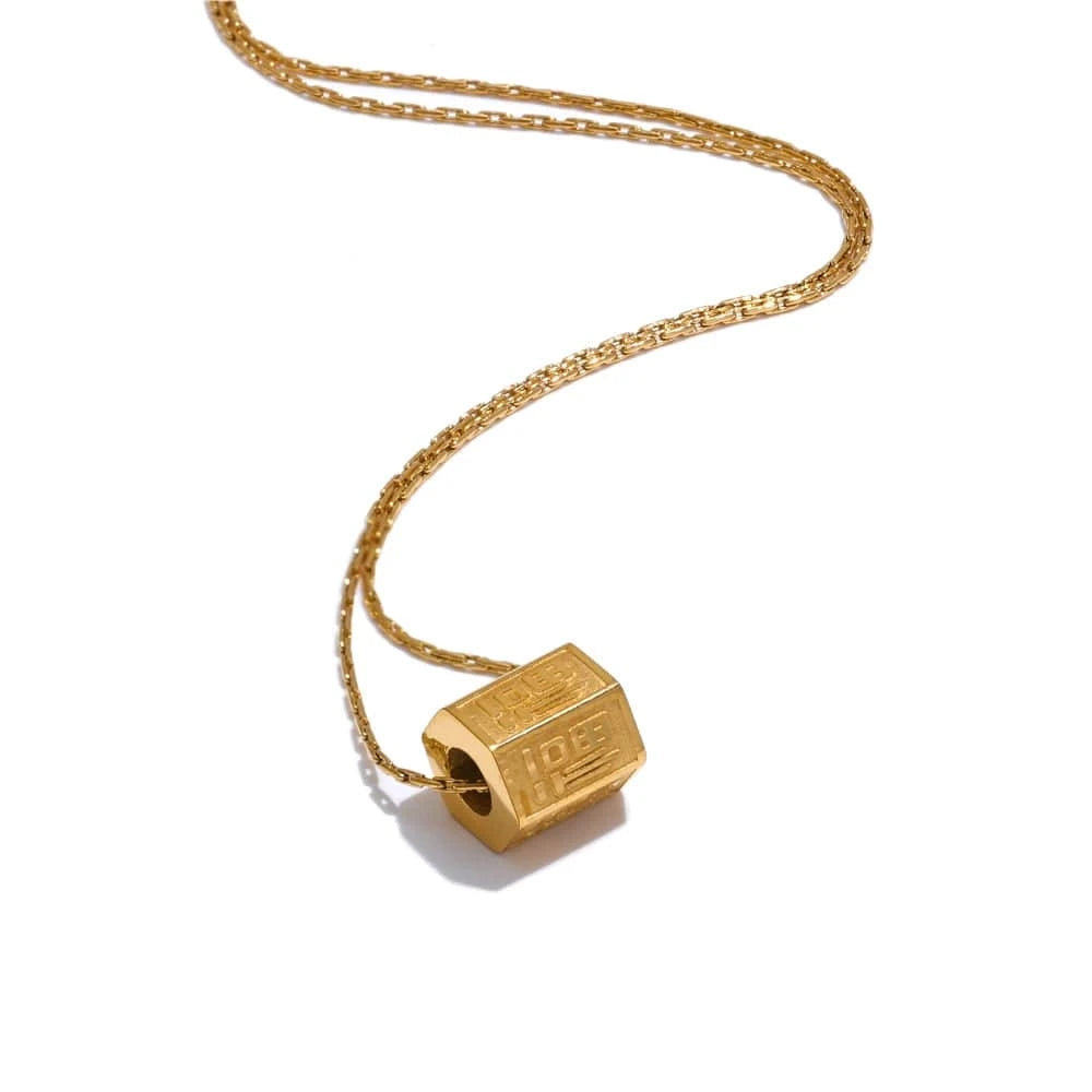 Gold necklace with a lock-shaped pendant on a white background
