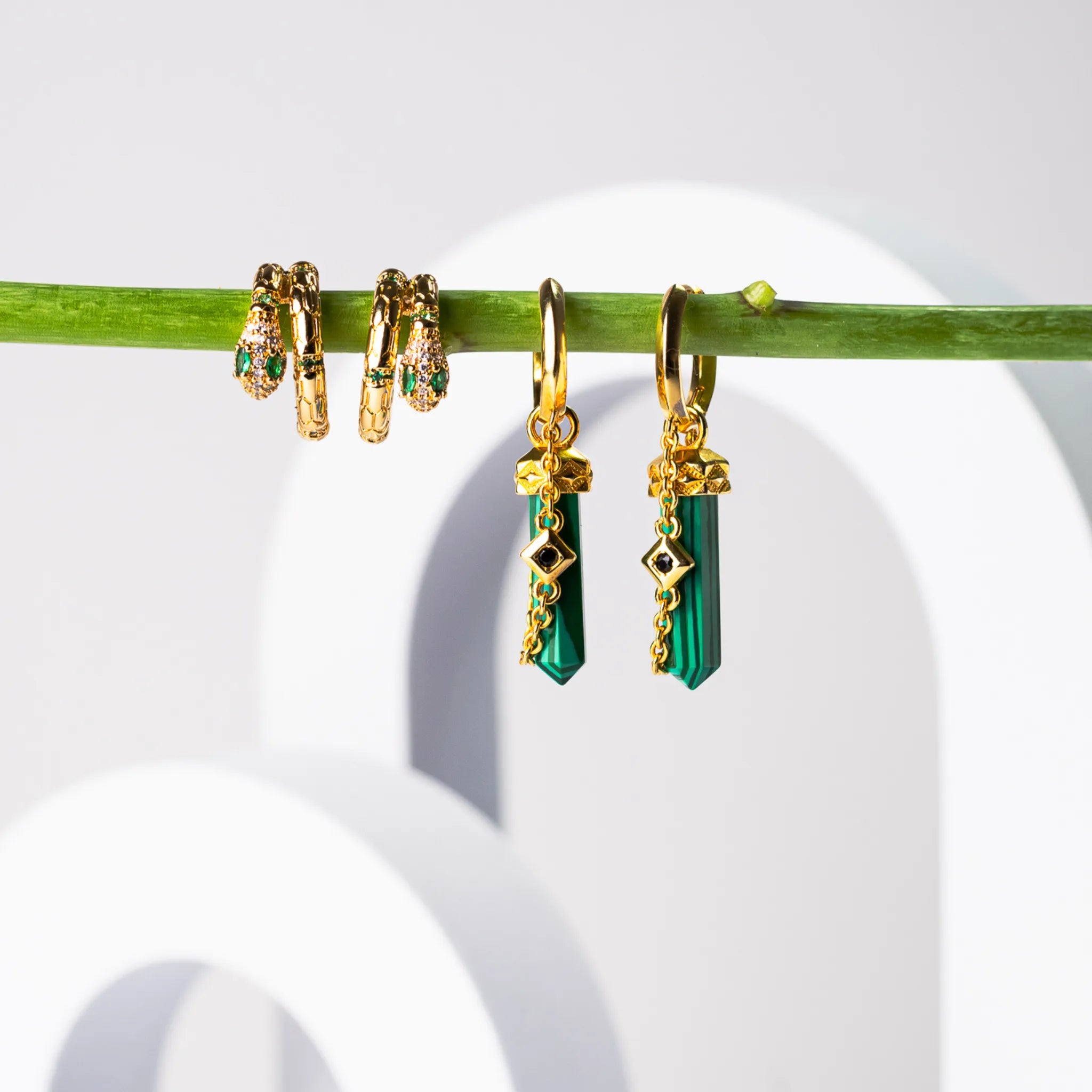 Gold-plated hoop earrings featuring a chain, third eye charm, and five-pointed faux malachite mini towers, symbolizing balance, growth, and spiritual awakening.