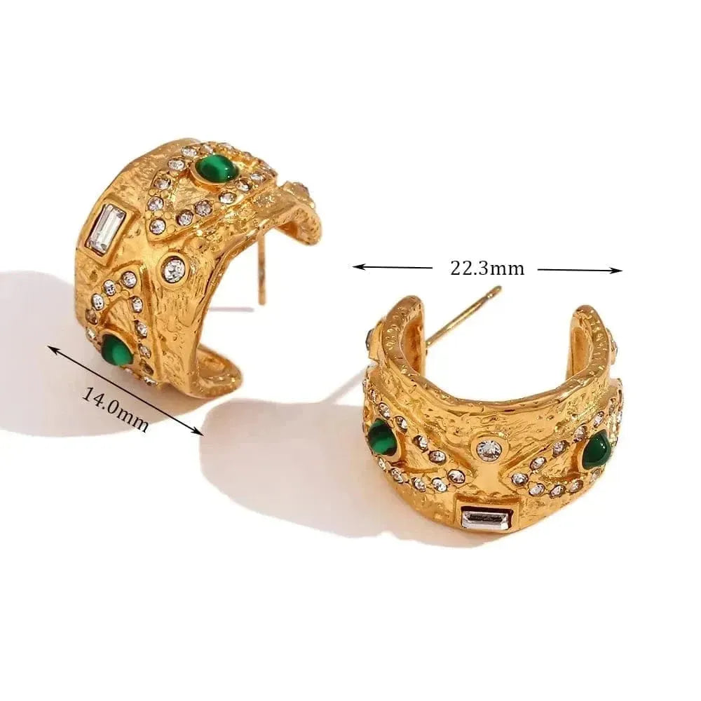 Gold hoop earrings with green gemstones and measurements on a white background