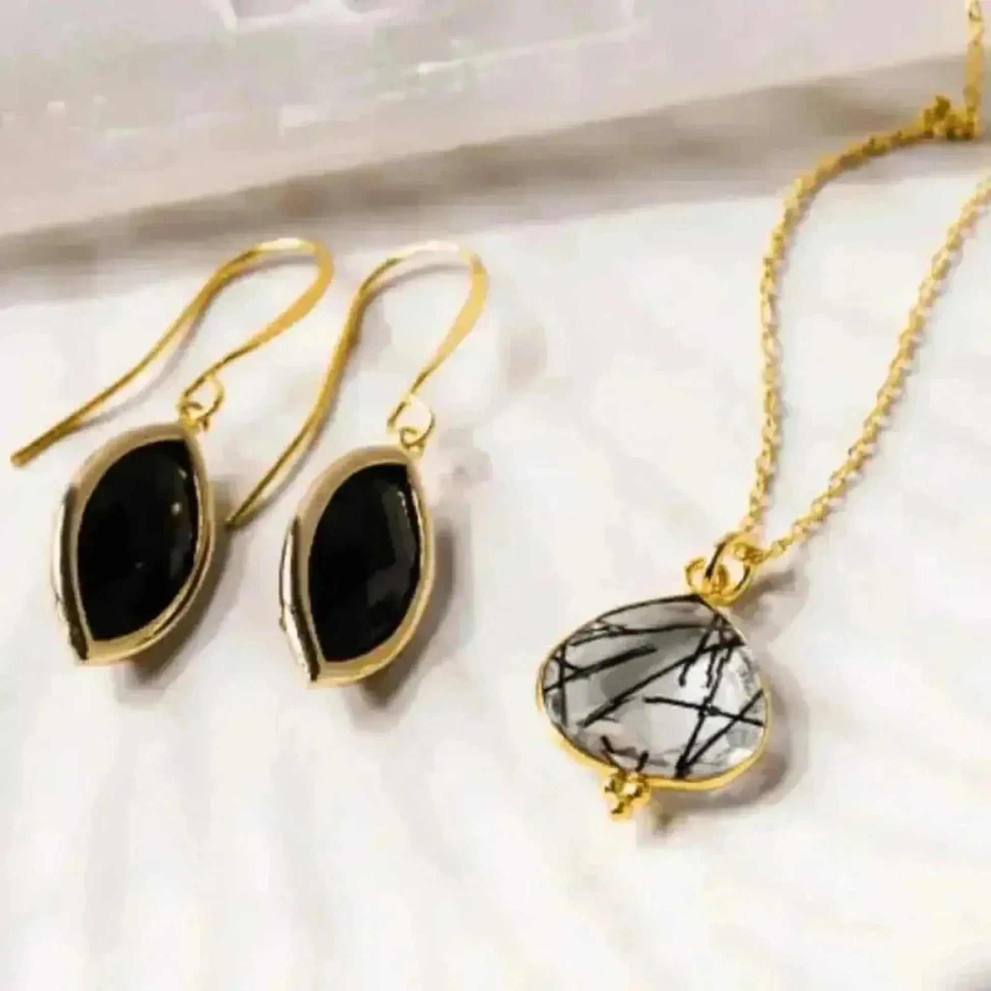 black gold earrings with rutilated quartz necklace