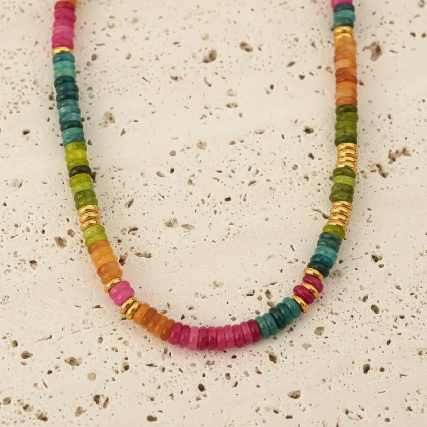 Necklace with multicolored beads on a white background