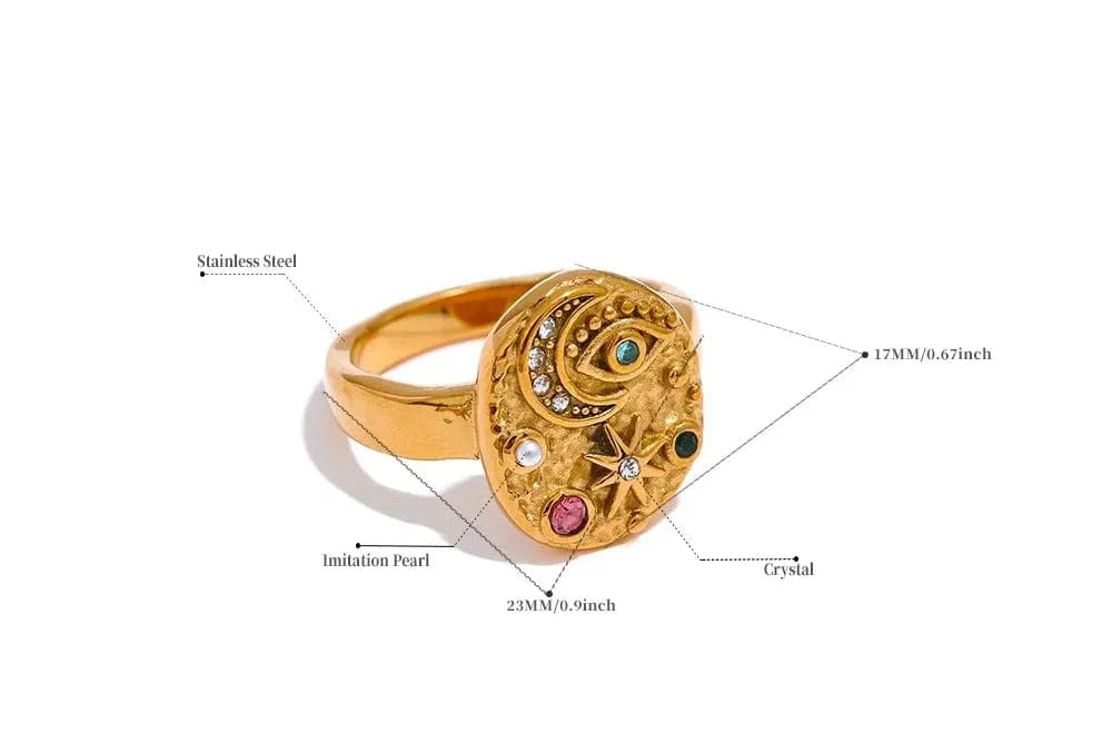 Gold ring with intricate design on a white background