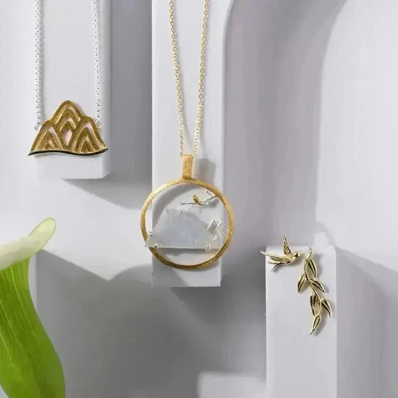 Gold necklaces and earrings on a white background