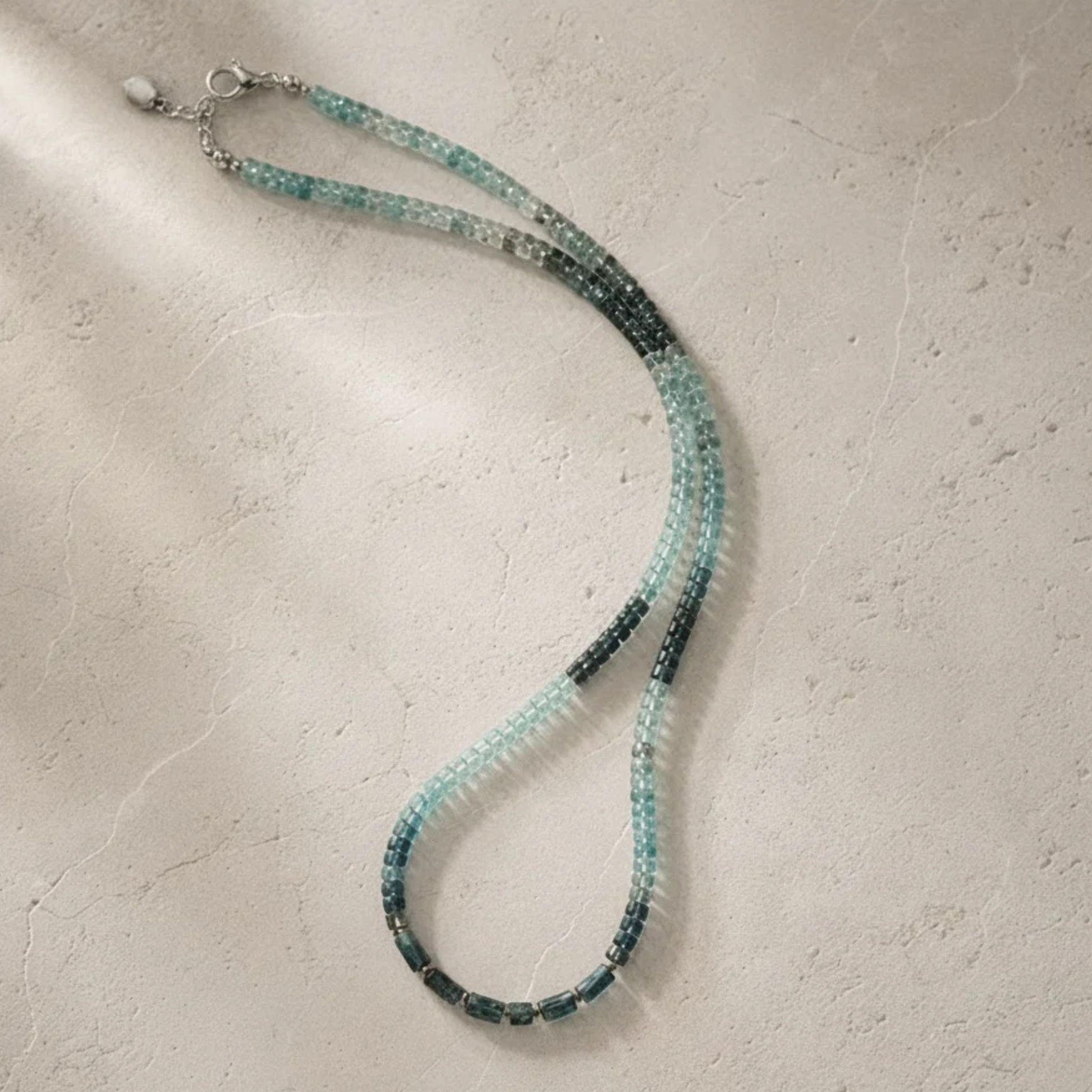 Ombré kyanite beaded necklace showing the pale-to-deep-teal blue gradient
