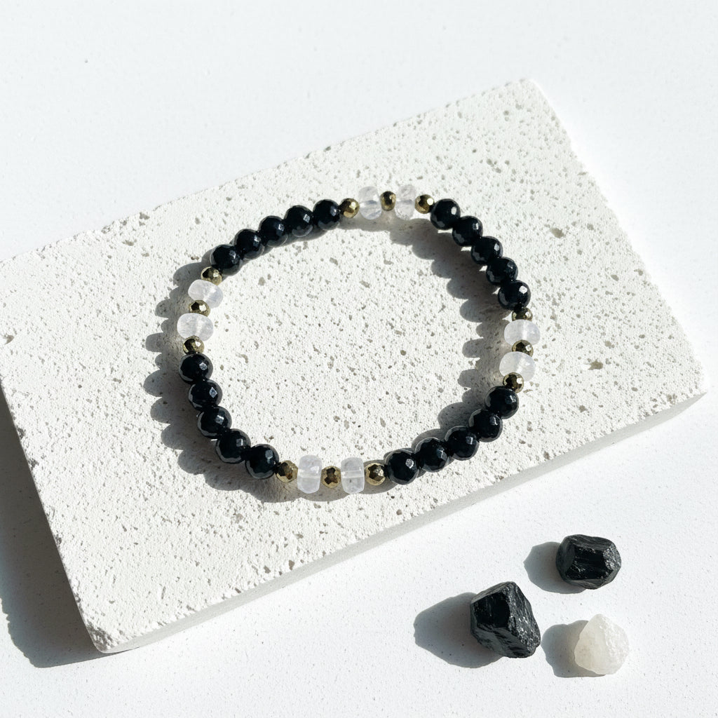 Onyx and moonstone stretch bracelet gold pyrite — faceted crystal jewelry for boundaries