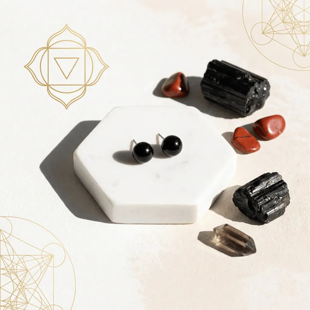 Black earrings on a white hexagonal stand with crystals on a light background