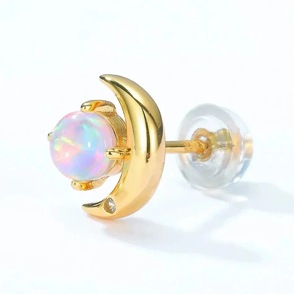 Gold moon-shaped earrings with a colorful gemstone on a white background