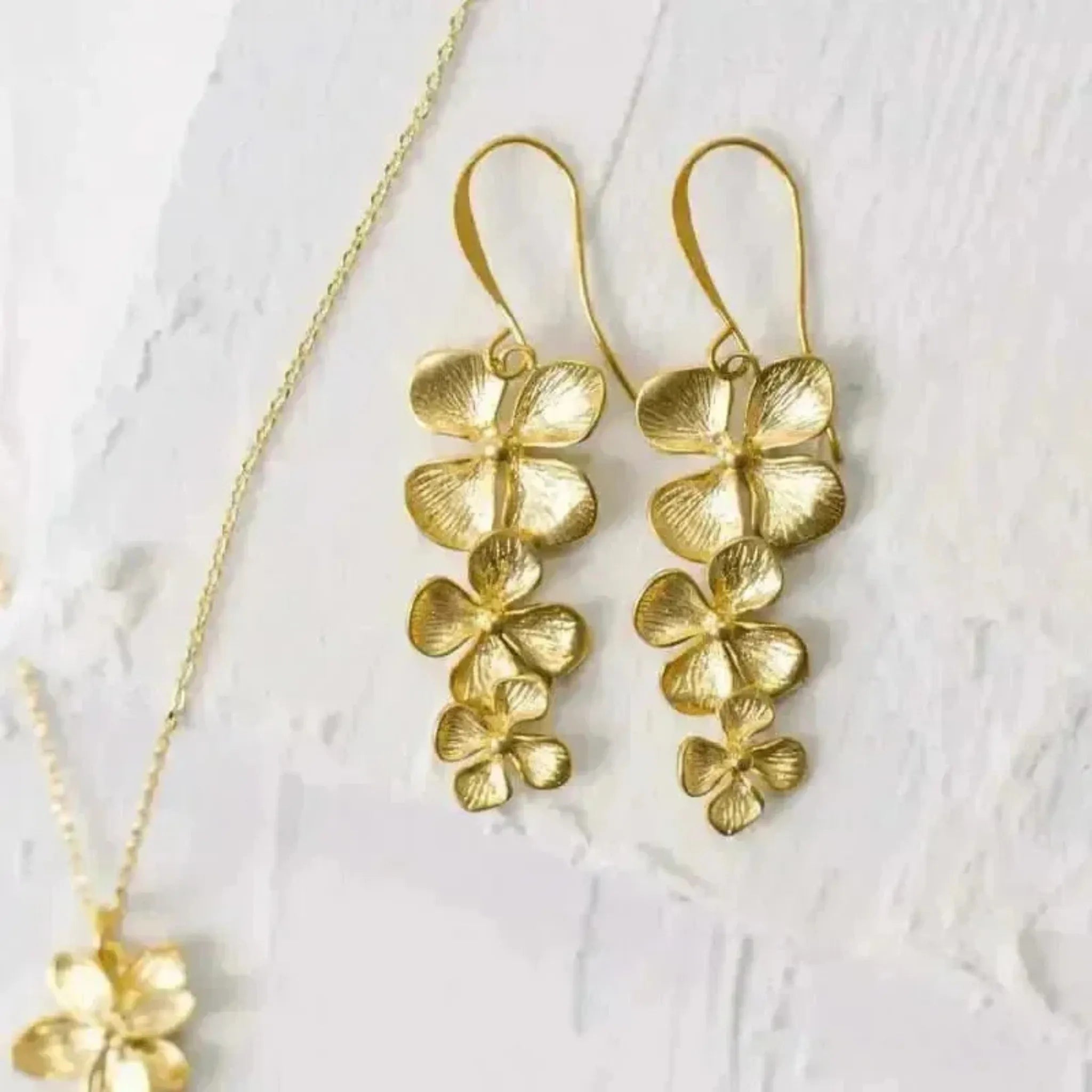 plumeria orchid earrings in gold