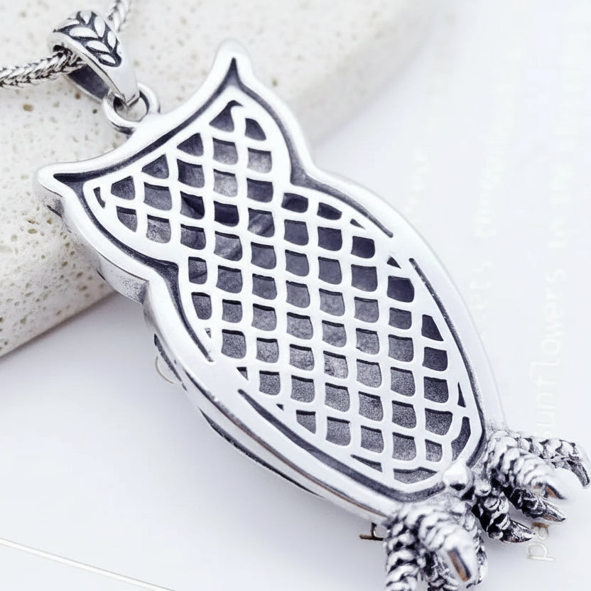Silver ring with a textured design and '925' stamp on a white background