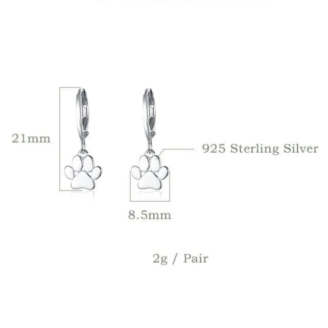 Silver paw print earrings with product data on a white background