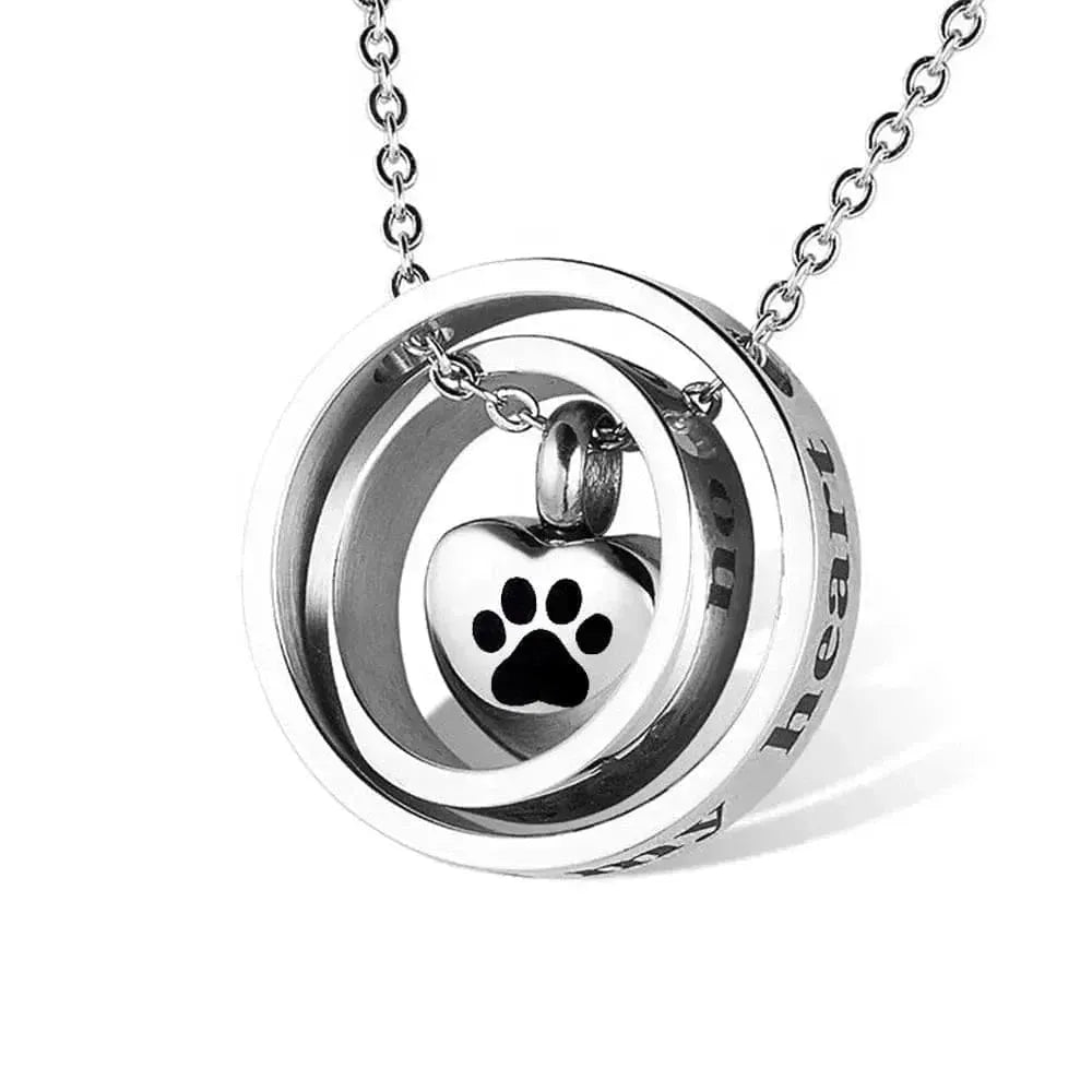 Silver necklace with a heart-shaped pendant featuring a paw print on a white background