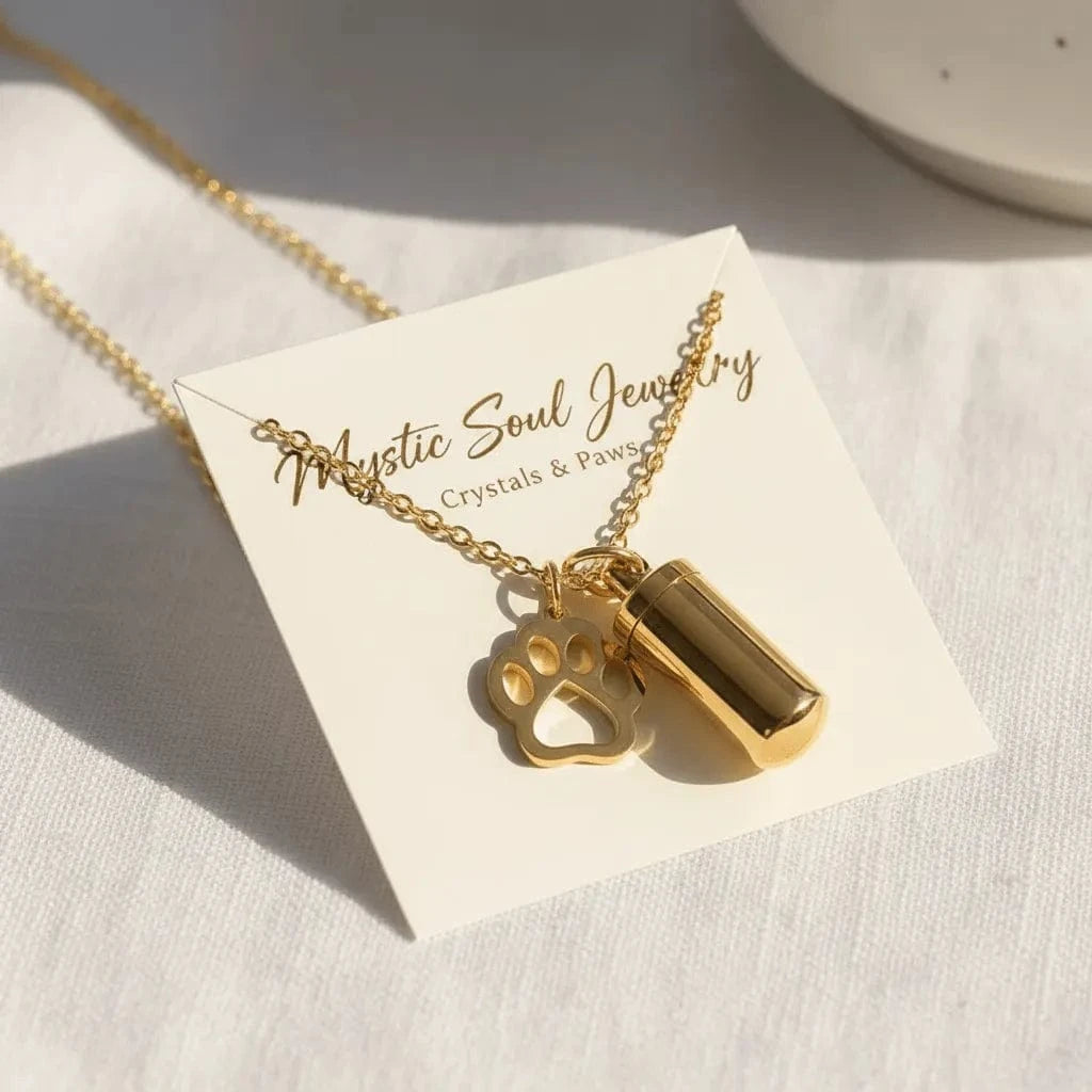 Gold necklace with paw charm on a 'Mystic Soul Jewelry' card